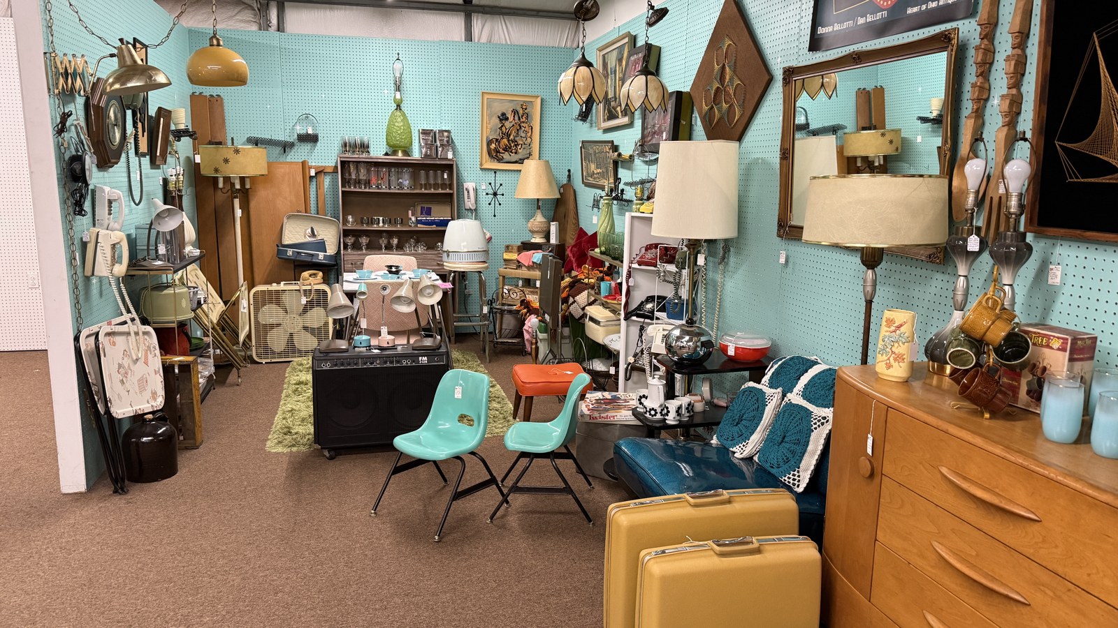 Mid-century furniture, lighting, and turquoise accents inside Heart of Ohio Antique Center