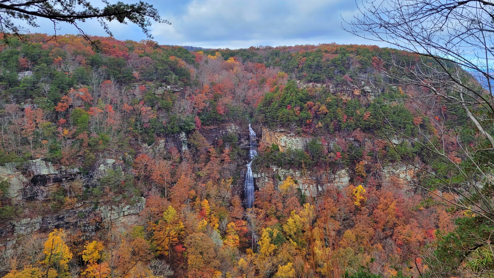 Cherokee Falls dropping through autumn color across the canyon at Cloudland Canyon State Park.