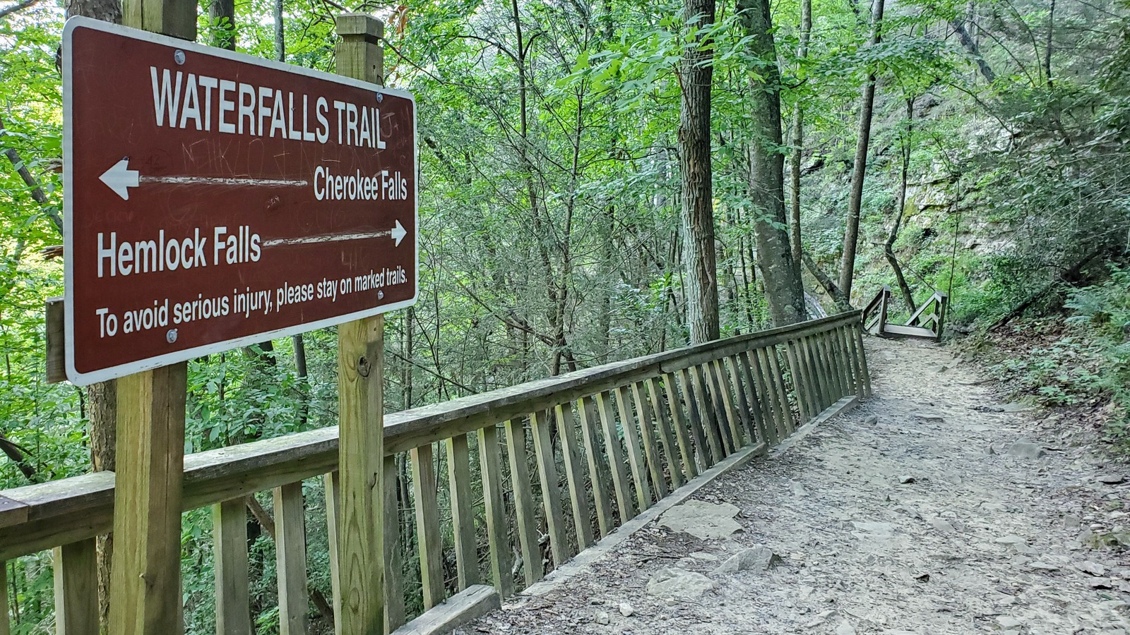 Waterfalls Trail sign pointing toward Cherokee Falls and Hemlock Falls at Cloudland Canyon State Park.