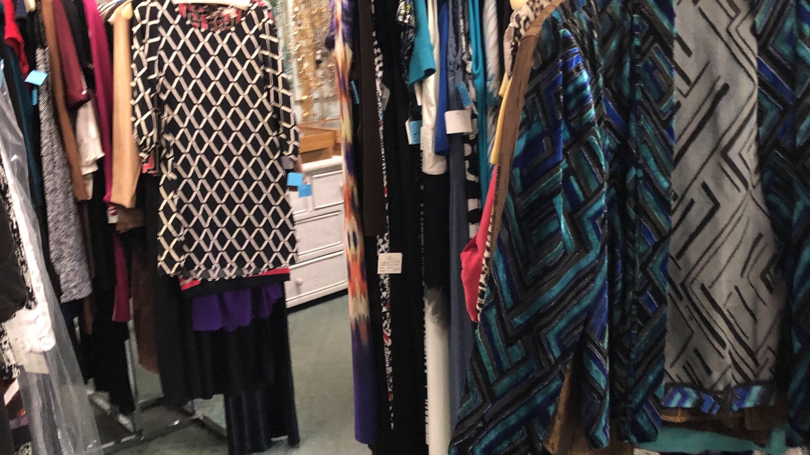 Colorful women's clothing racks inside Chic Again in Lake Havasu City