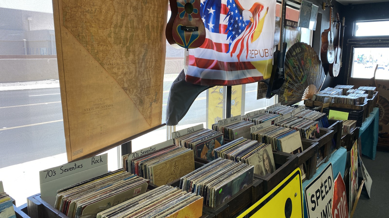Vinyl records guitars and vintage decor inside Lookie Loo's
