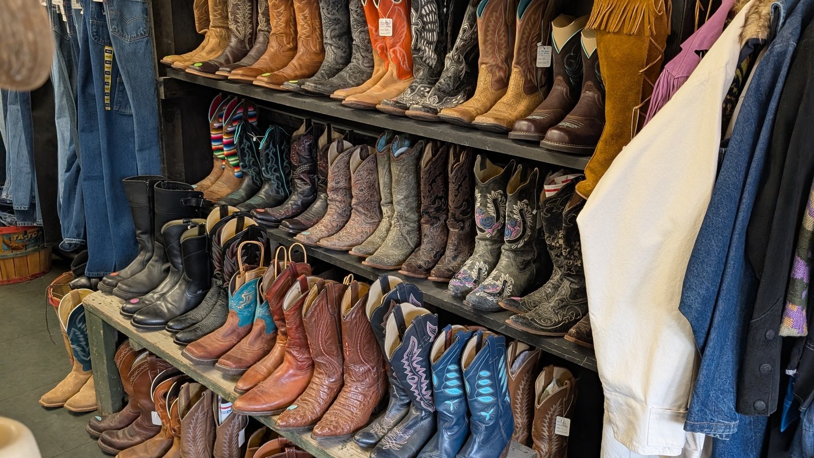 Rows of colorful secondhand cowboy boots at Lucky Score Clothing Company in Pendleton Oregon