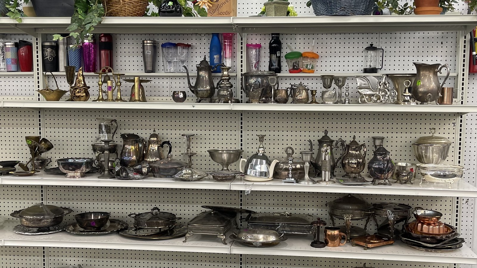 Silver-tone serving pieces and decorative housewares at American Thrift Store in Hollywood