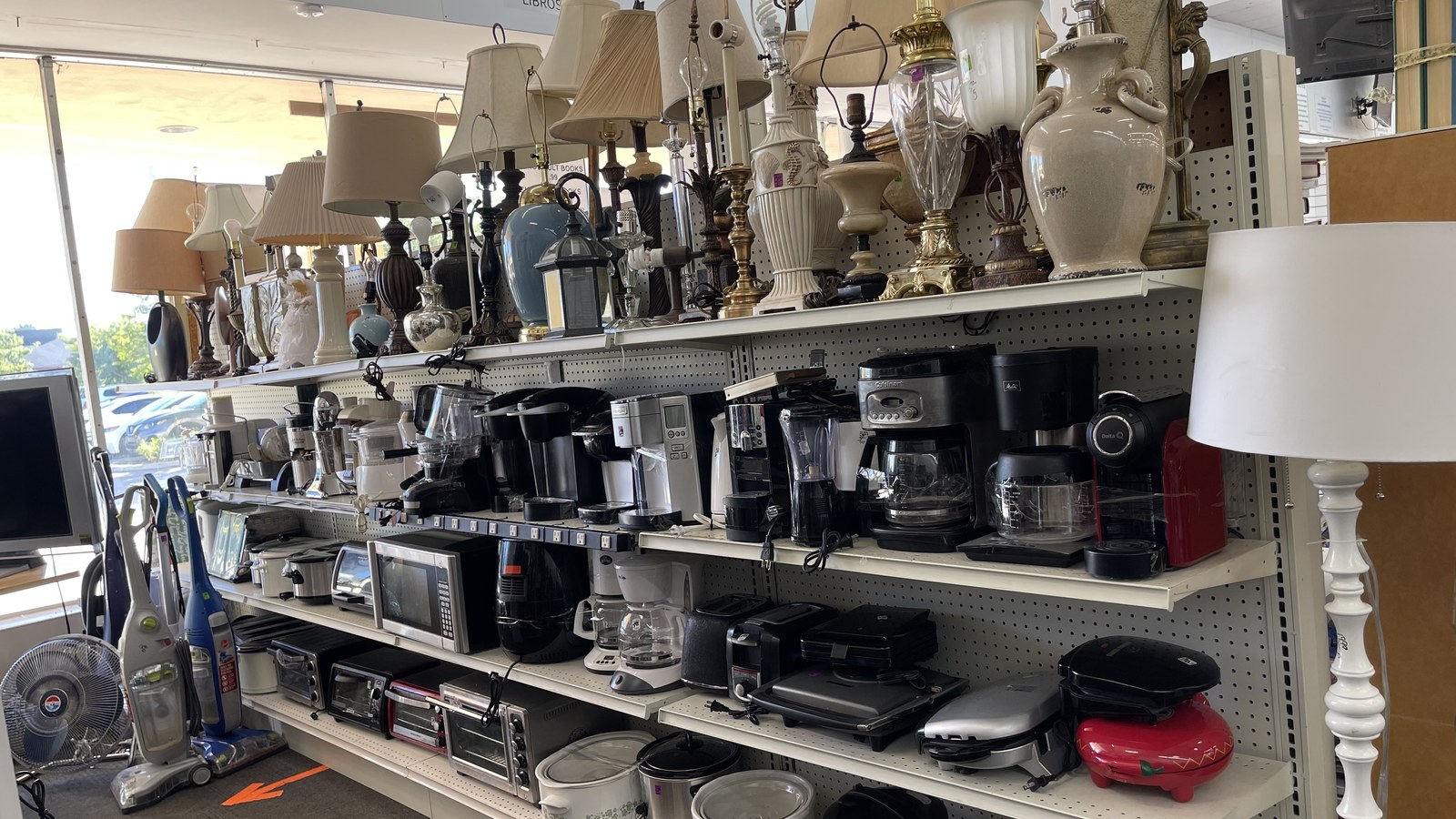 Small appliances and lamps on shelves at American Thrift Store in Hollywood