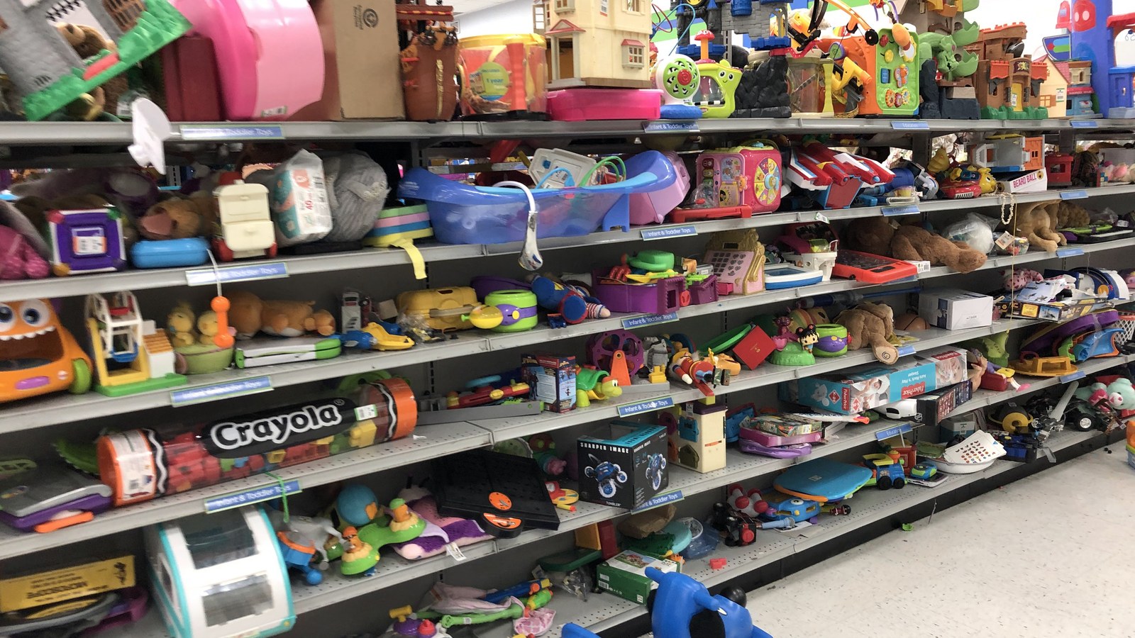 Colorful shelves of secondhand toys at 2nd Ave in Laurel Maryland