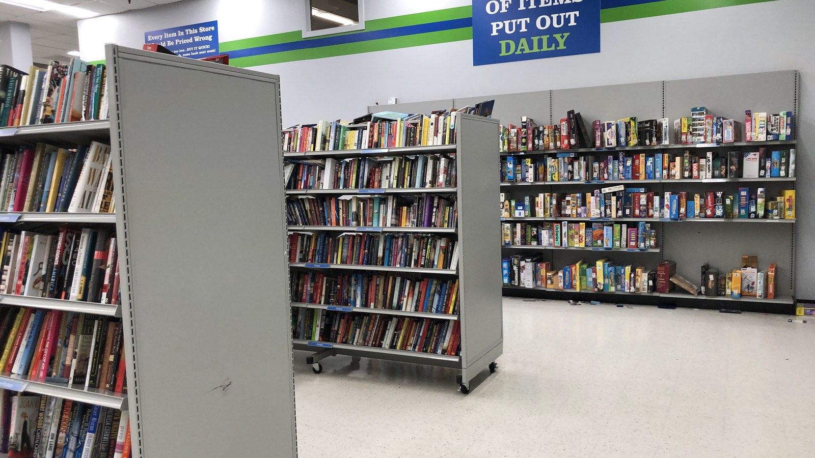 Rows of secondhand books beneath the color-of-the-day display at 2nd Ave Laurel