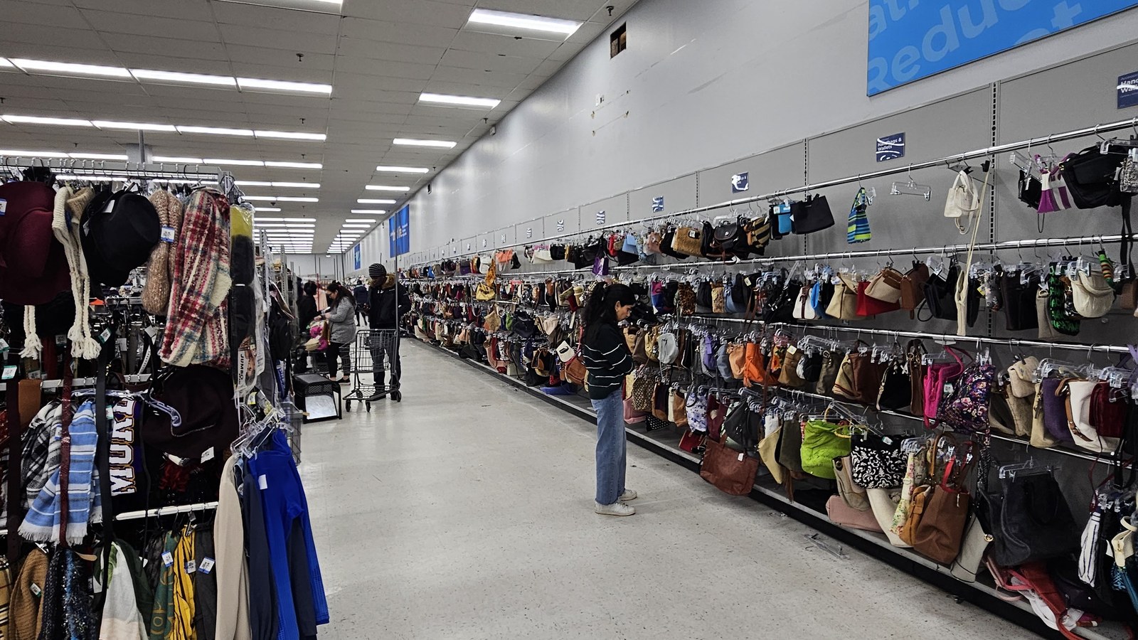Long apparel aisle and accessory wall at 2nd Ave Thrift Store in Laurel