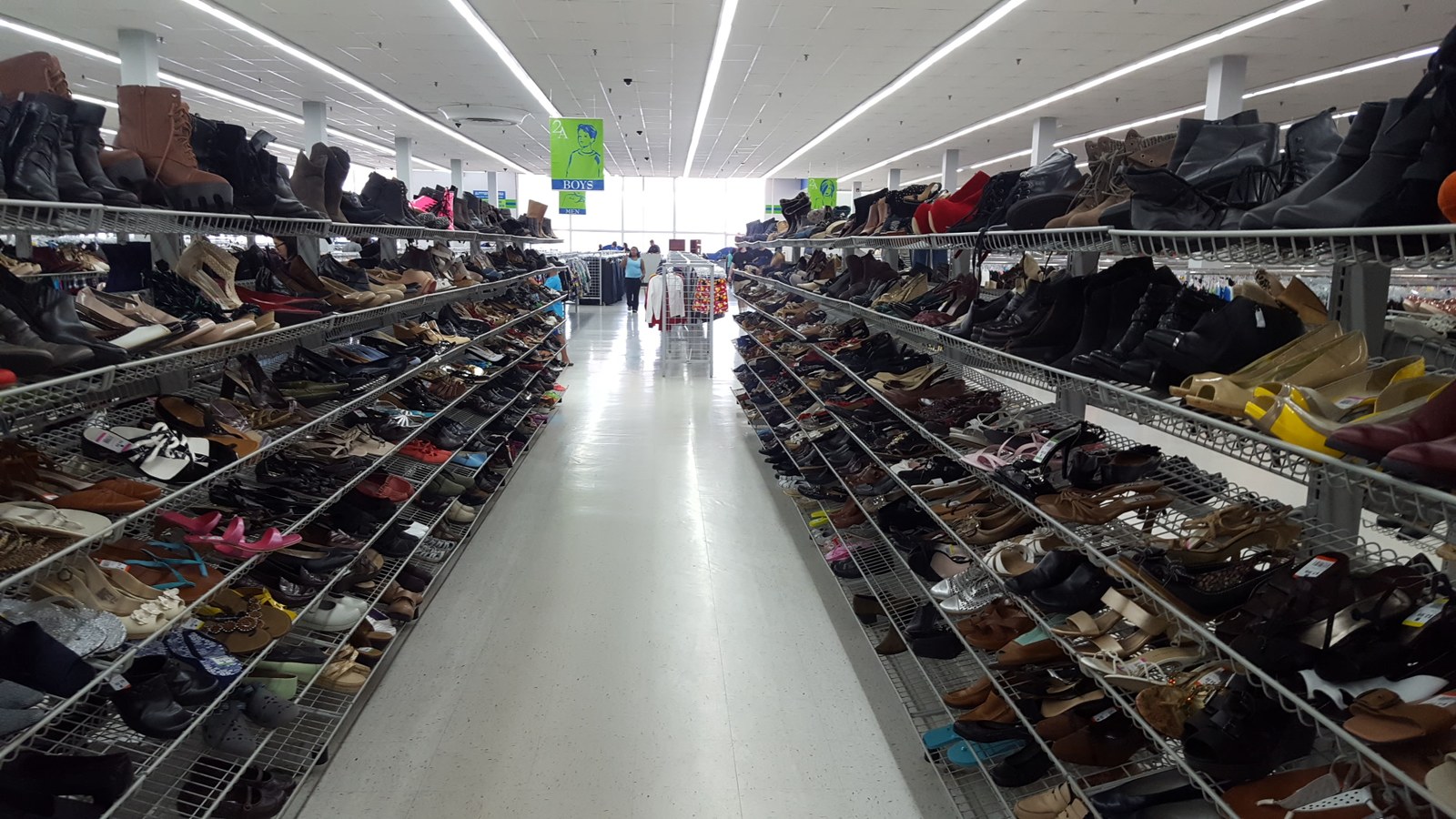 Bright shoe aisle with long rows of footwear at 2nd Ave Laurel