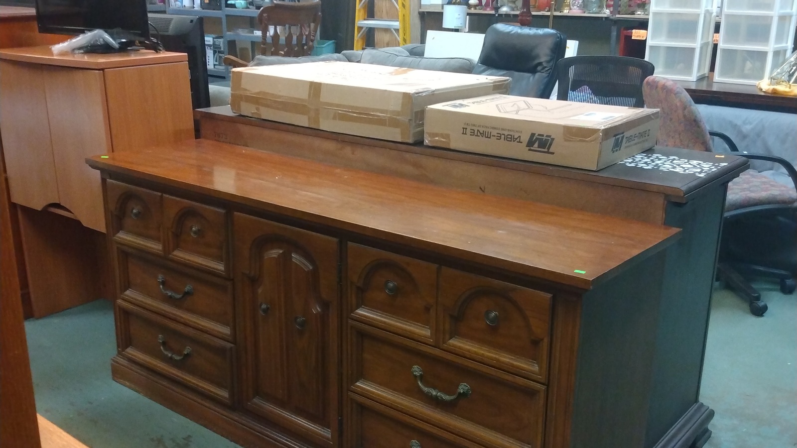 Wood dresser and larger furniture pieces at New Life Thrift in Glenside