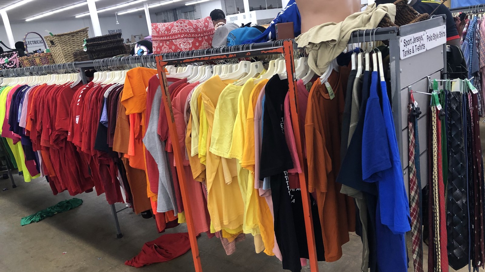 Rainbow rows of shirts at Red White and Blue Thrift Store in Hialeah