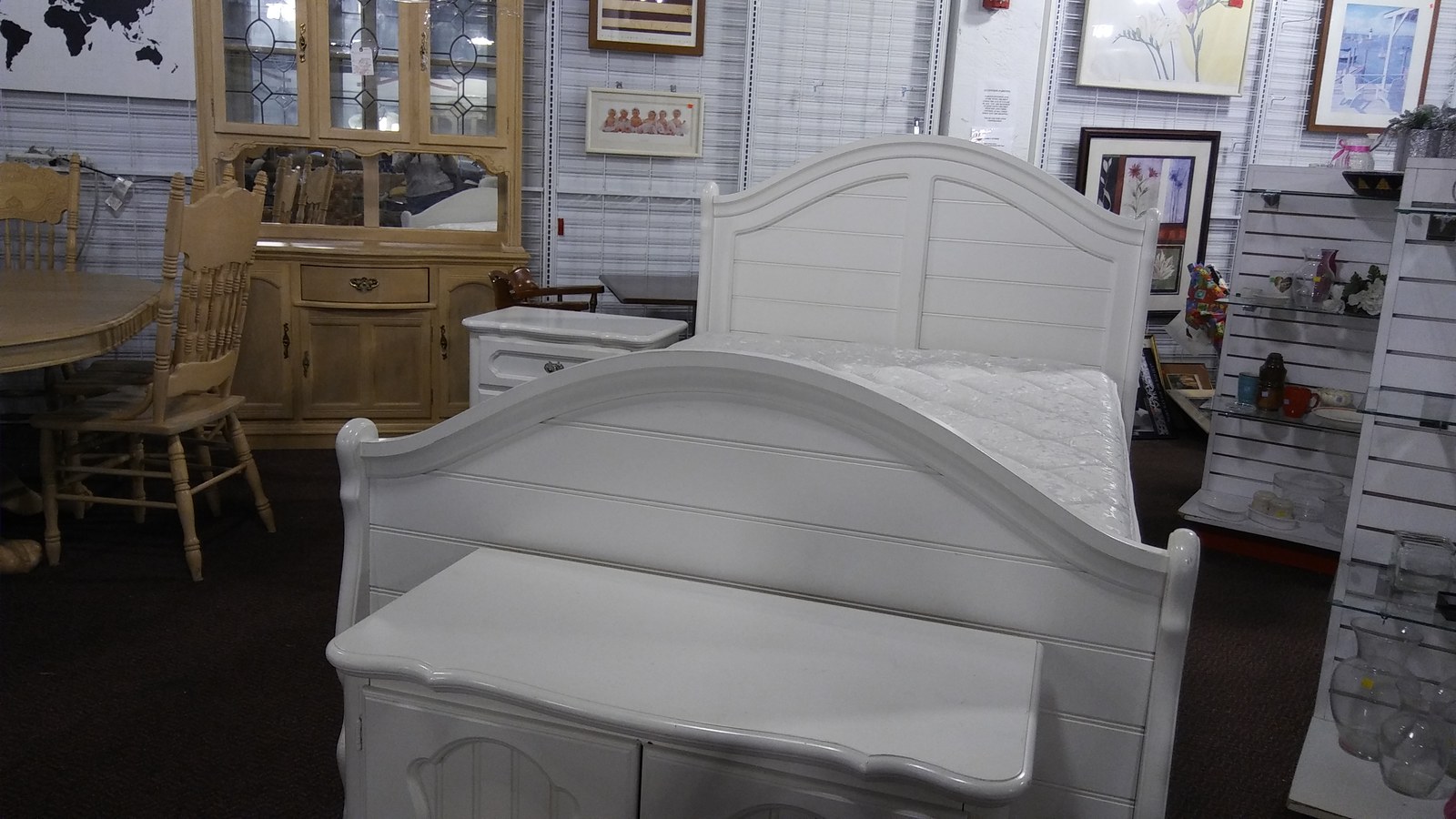 White bed frame and matching furniture at Red White and Blue Thrift Store