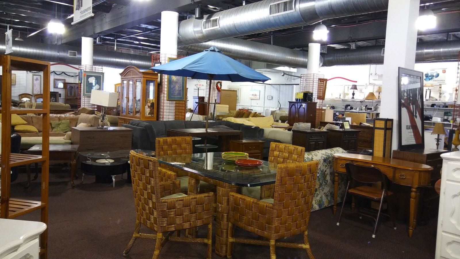 Dining tables and woven chairs on the spacious Hialeah furniture floor
