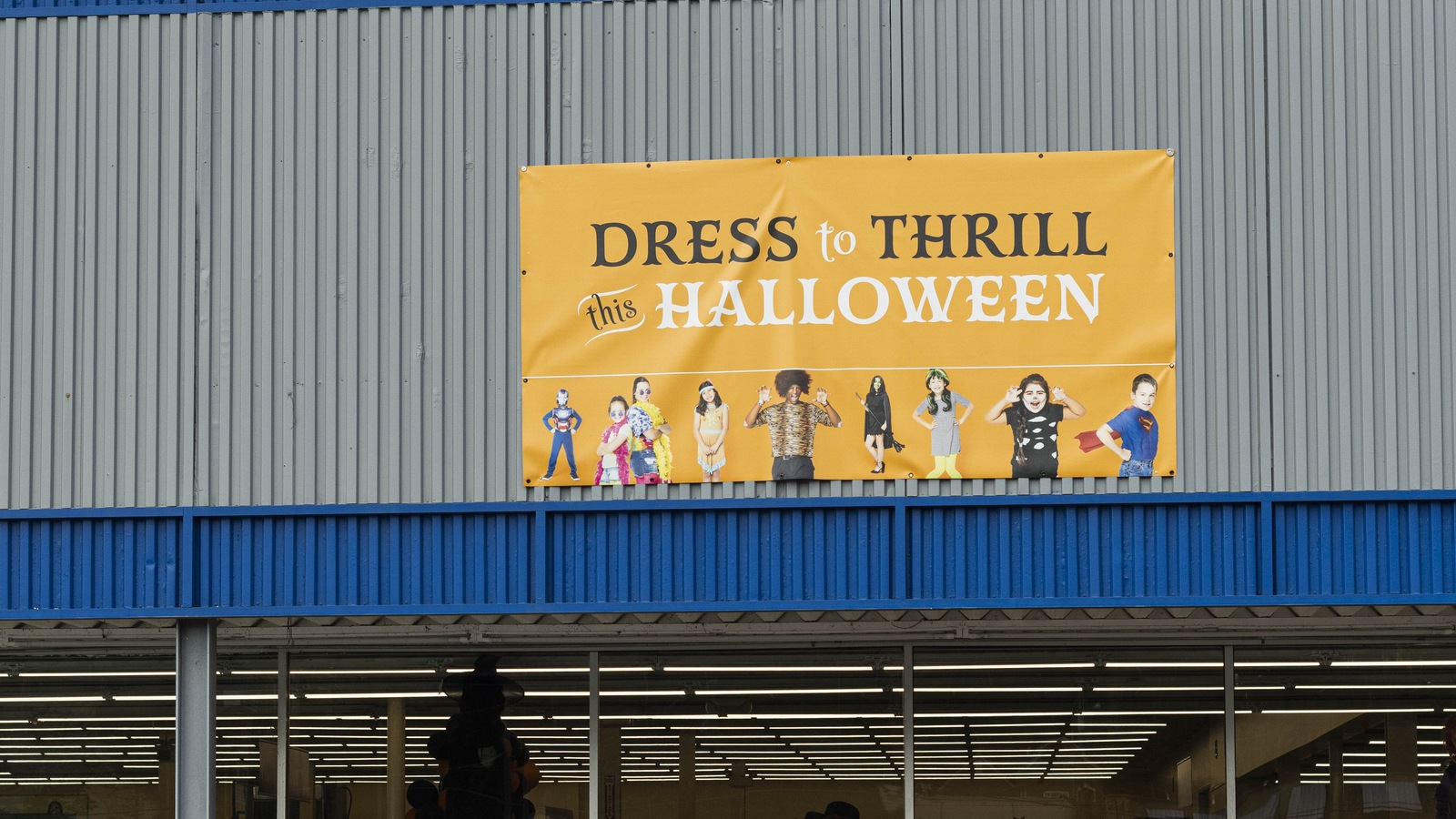 Dress to Thrill Halloween sign above the Jasper thrift store floor