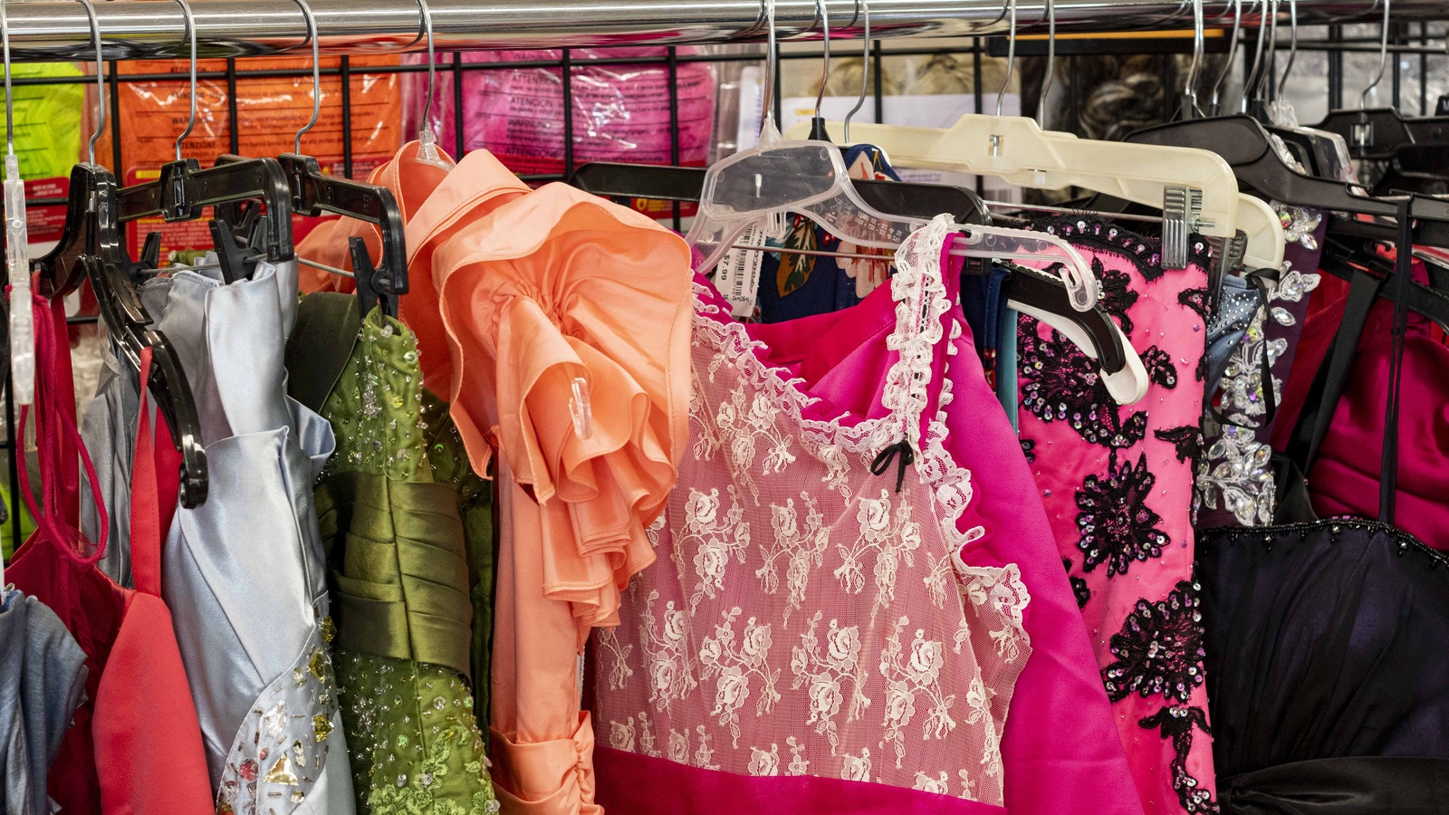 Colorful formalwear and dresses on a Jasper thrift store rack