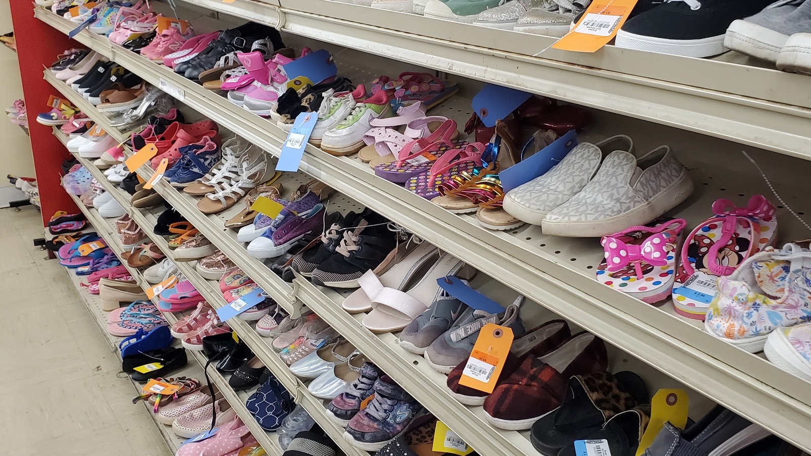 Shelves of adult and children's shoes at America's Thrift Store in Jasper