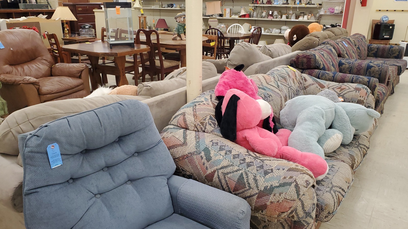 Sofas and upholstered chairs on the Jasper thrift store furniture floor