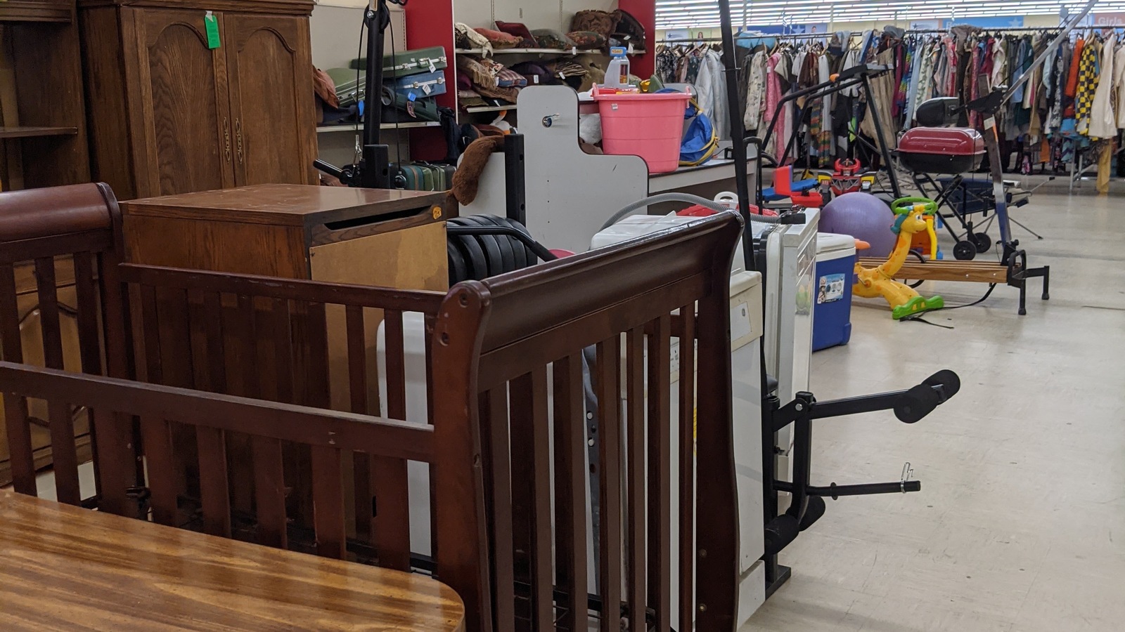 Wood furniture and nursery pieces grouped on the sales floor