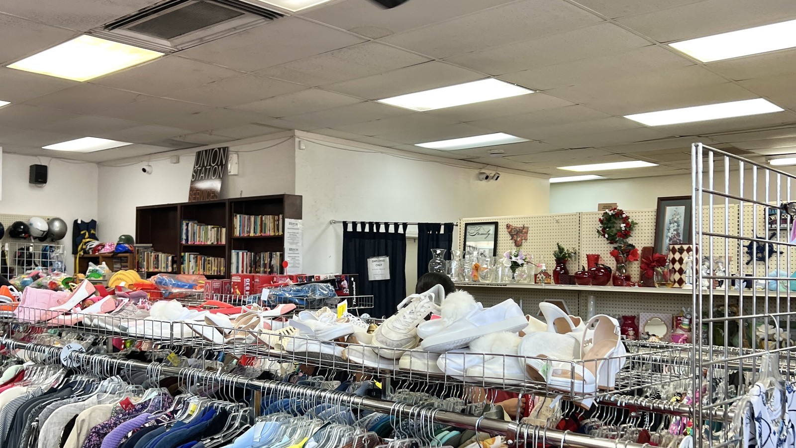 Colorful clothing racks inside ACTS Thrift Store in Pasadena