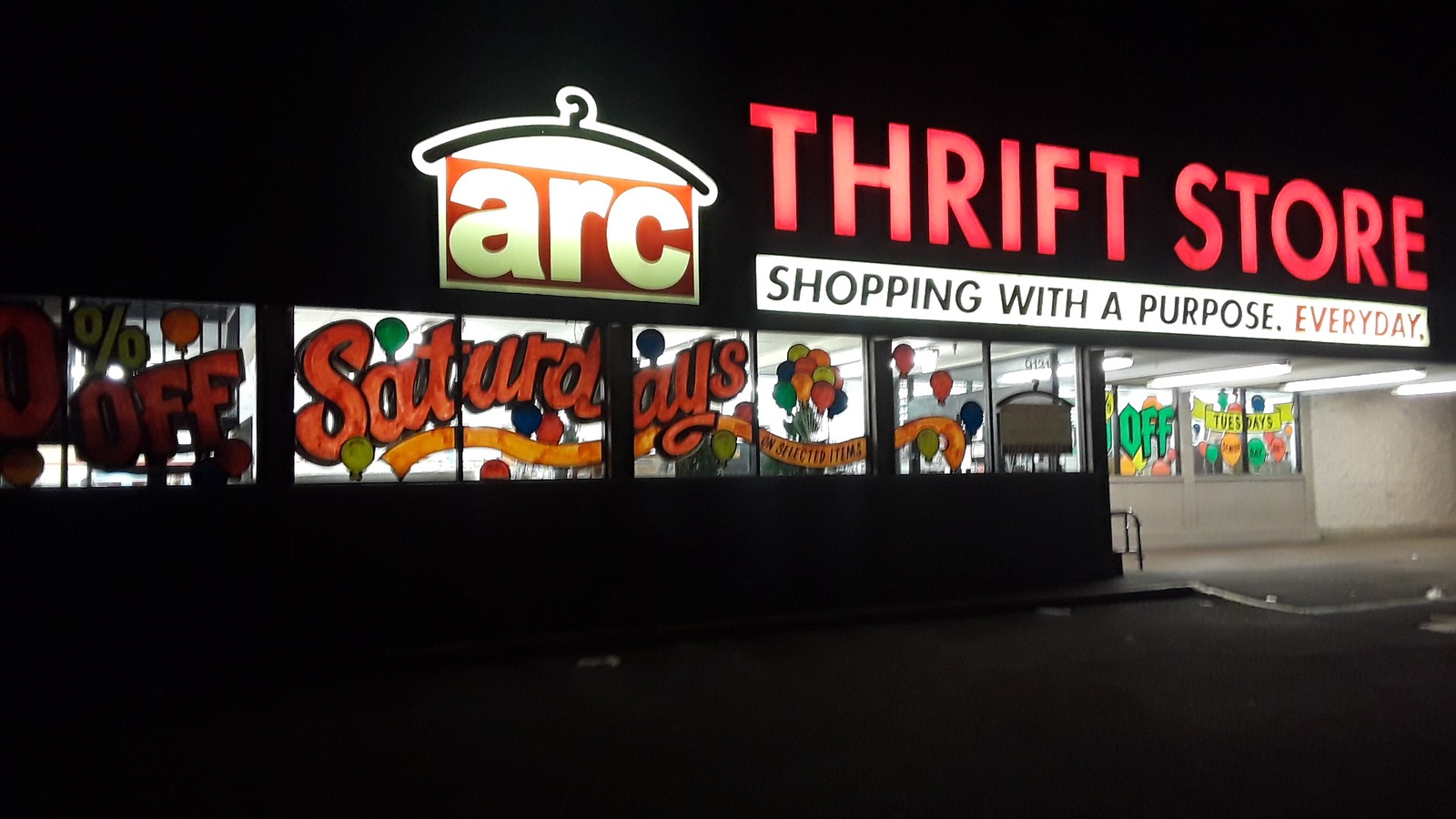 Illuminated ARC Thrift Store sign in Thornton at night