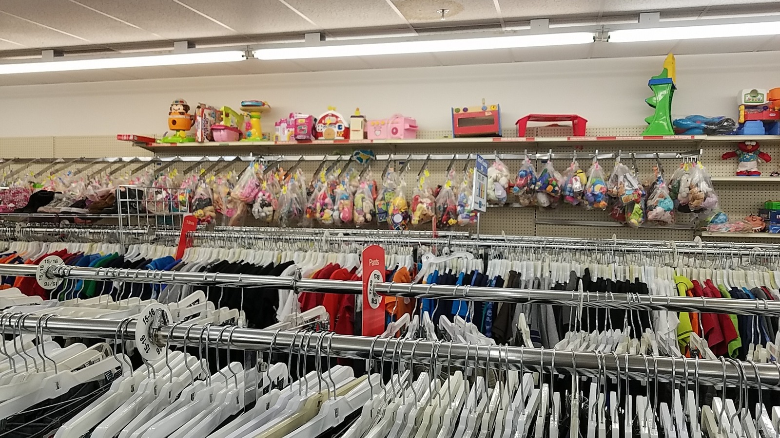 Clothing racks filled with colorful garments in Thornton