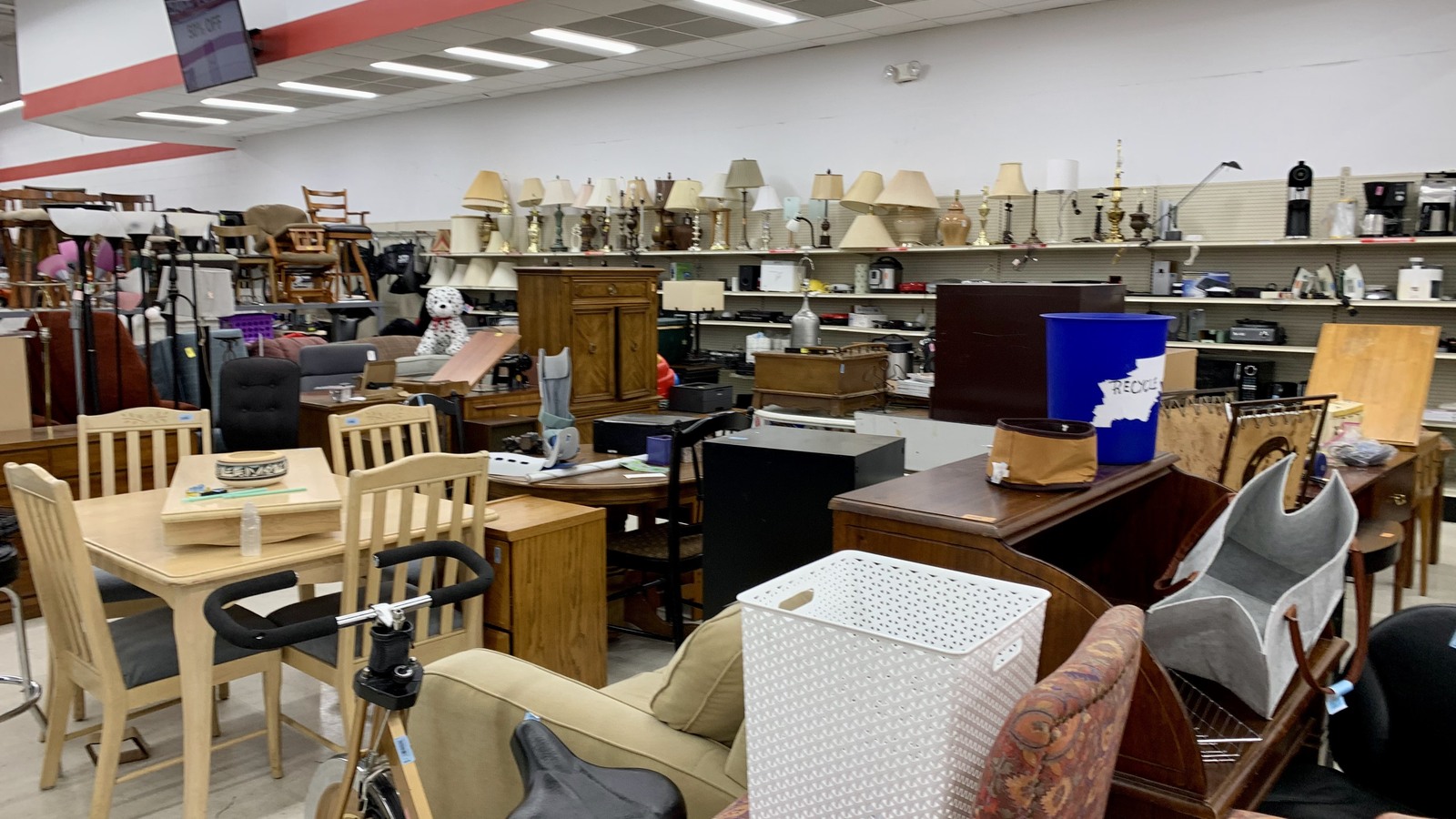 Tables, chairs, lamps, and cabinets in the furniture department