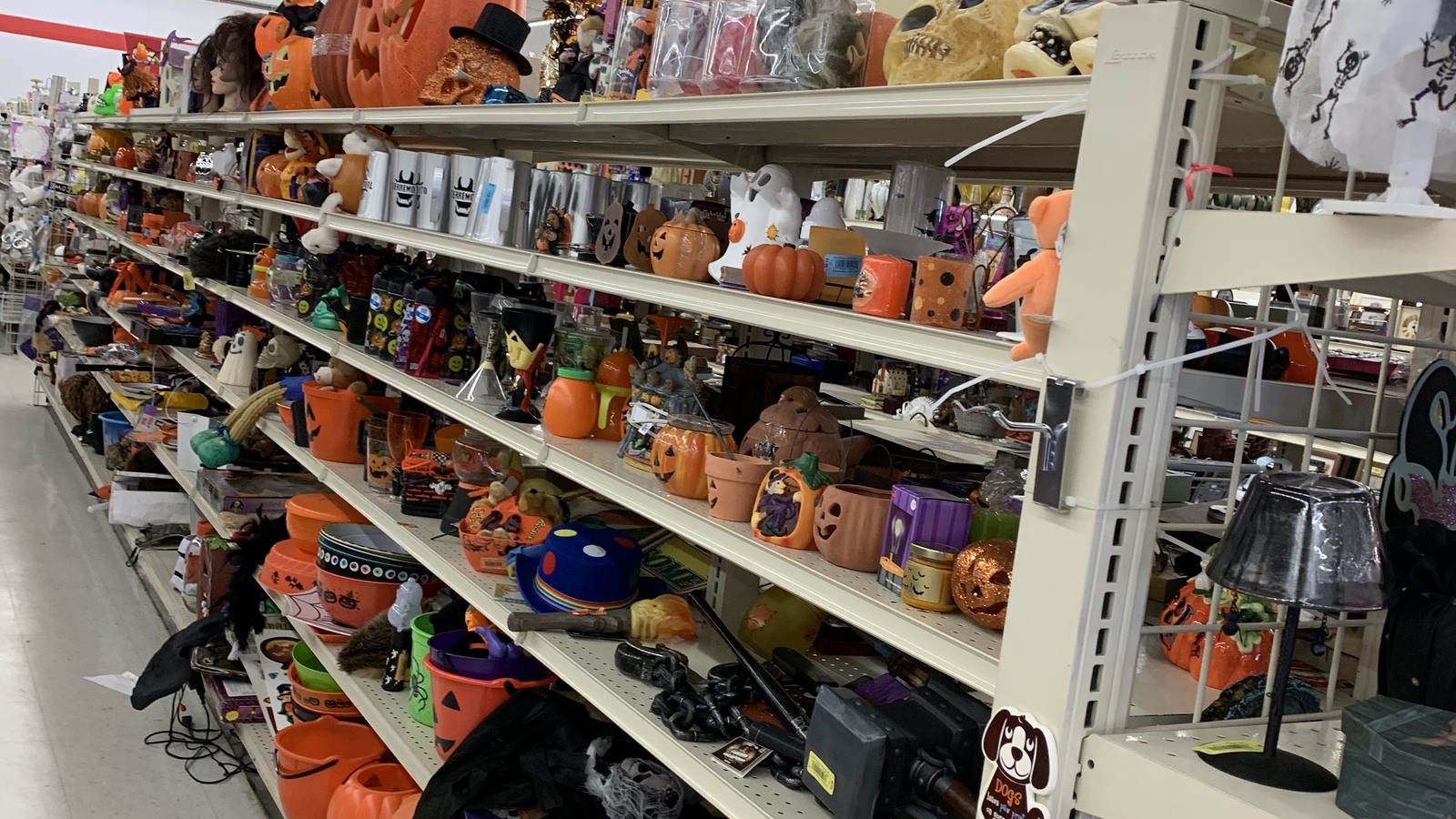 Seasonal mugs and decorations arranged along a housewares aisle