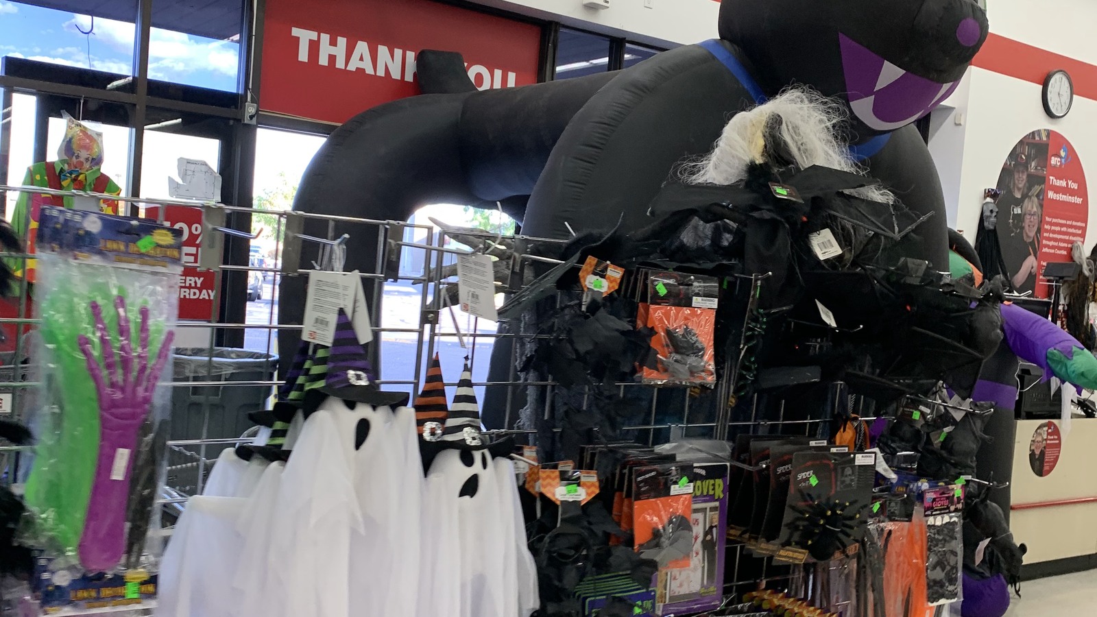 Halloween costumes and decorations gathered near the entrance