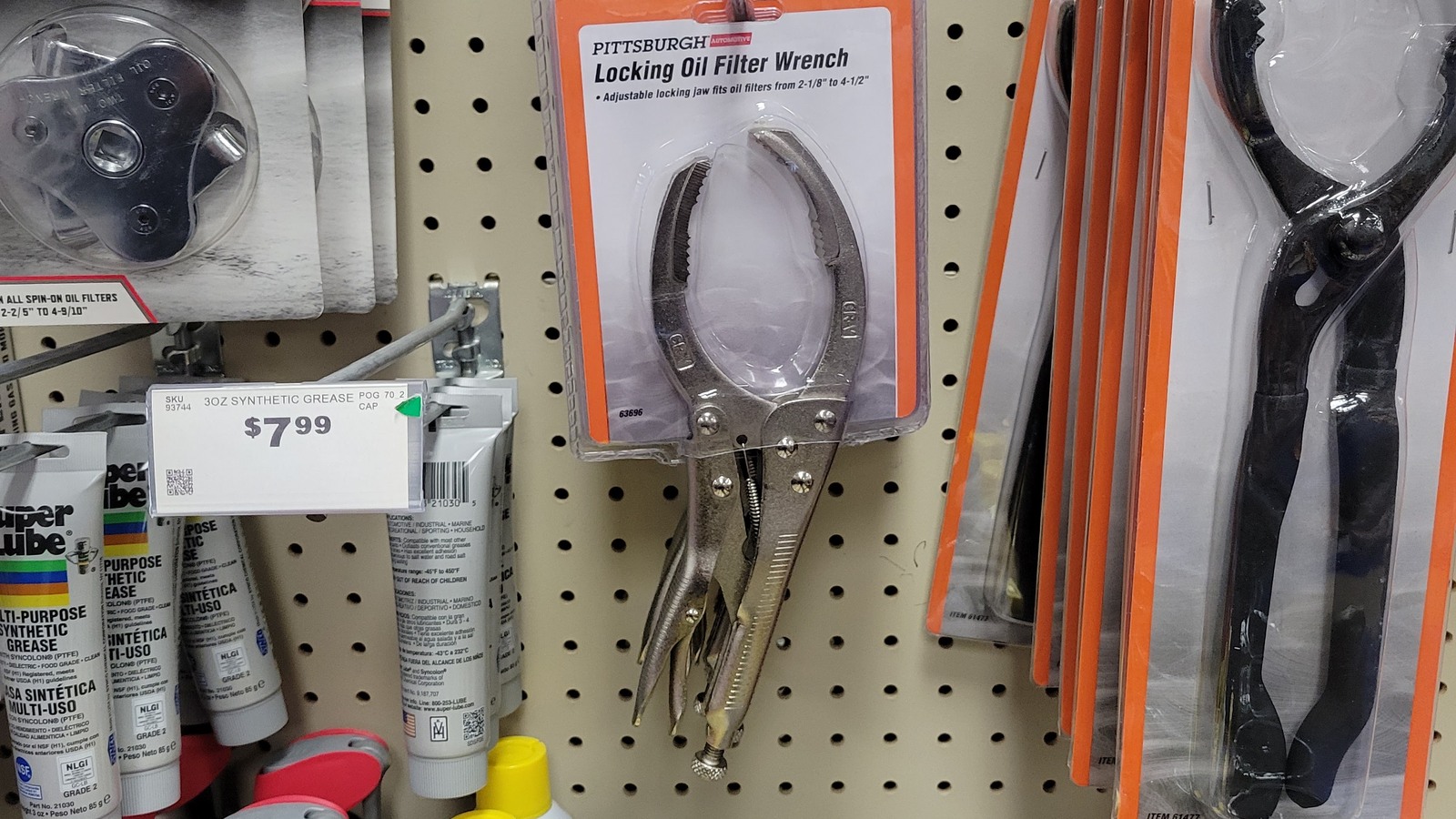 Wrenches and practical household tools displayed on pegboard