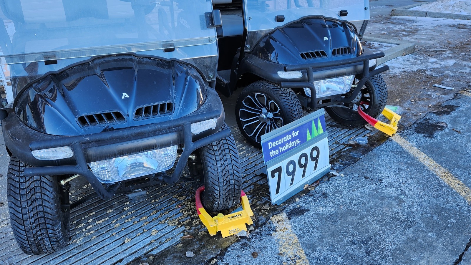Two blue children's ride-on vehicles outside the thrift store