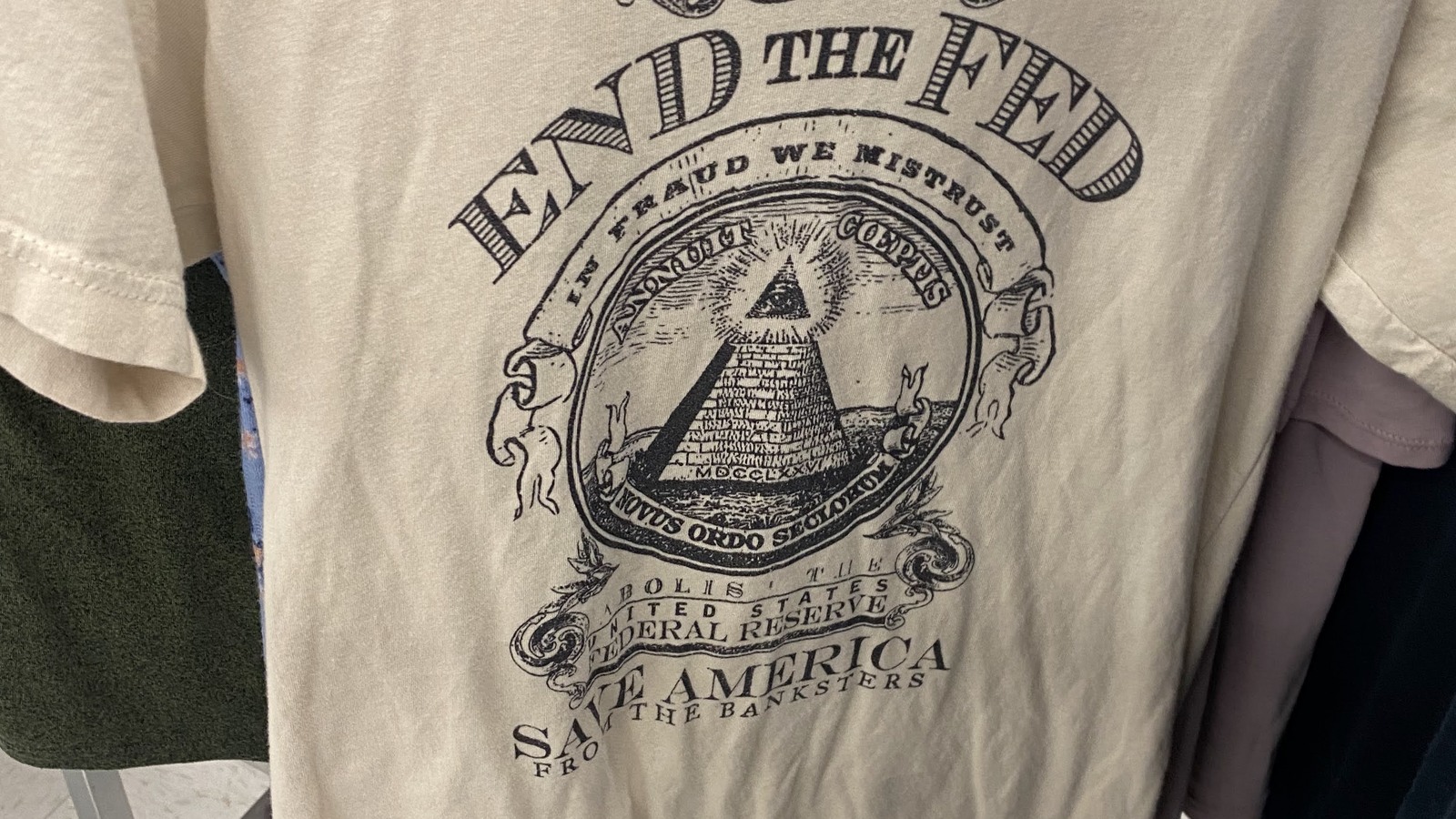 Vintage-style graphic T-shirt hanging in the clothing department