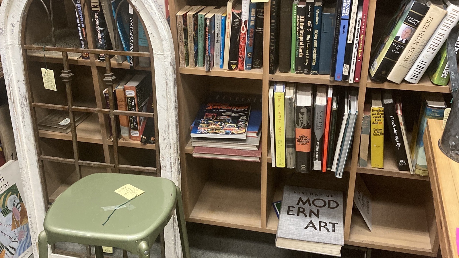 Books and wood shelving in the book section at Valley Thrift Store