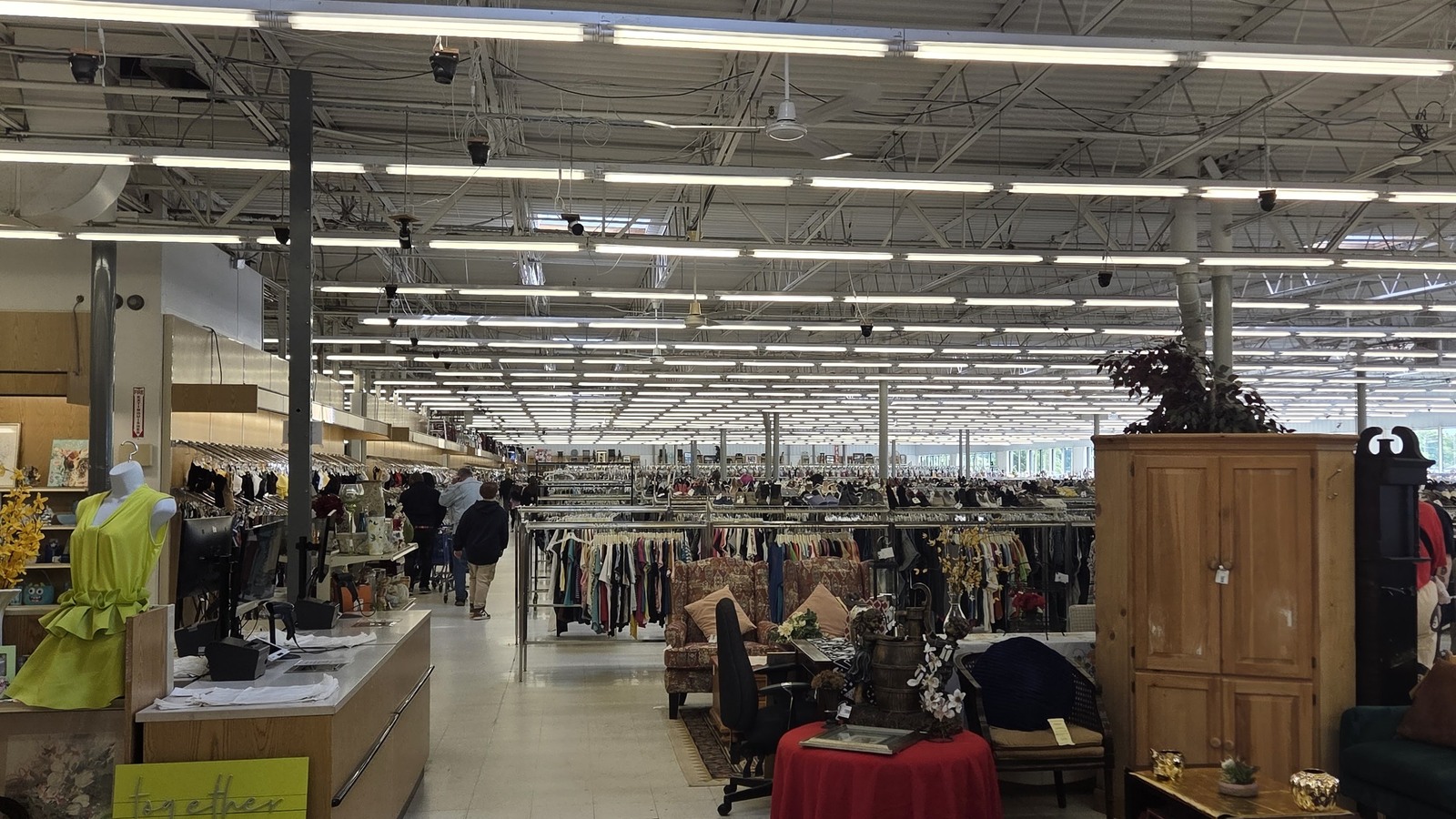 Spacious sales floor with clothing racks and furniture at Valley Thrift Store in Kettering