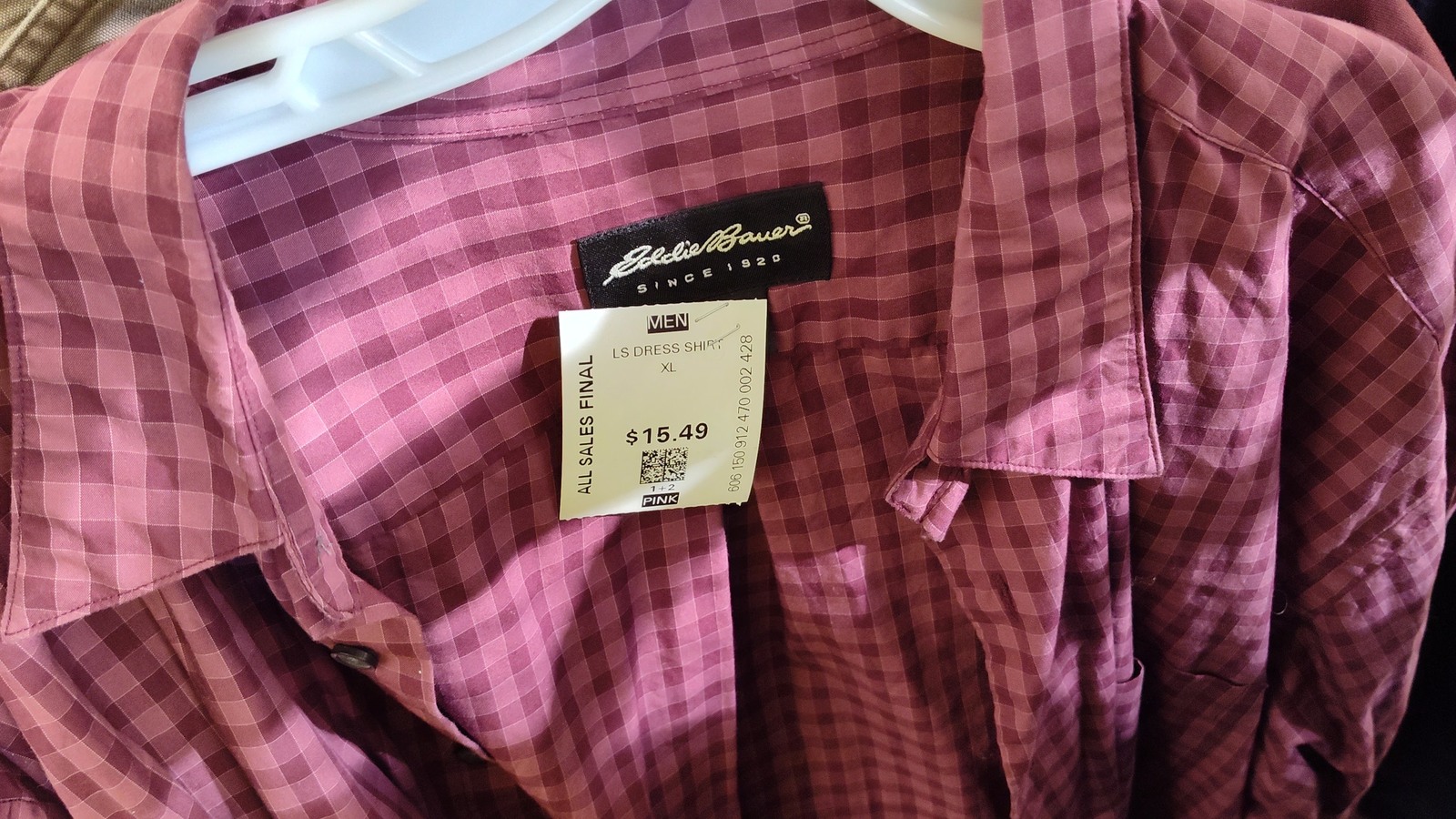 Purple plaid button-down shirt on a clothing rack at Valley Thrift Store