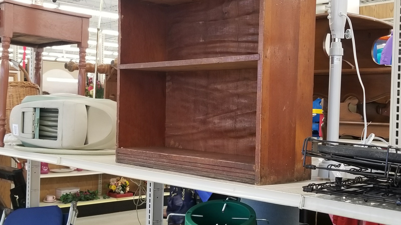 Wood shelving and compact household appliances at Valley Thrift Store