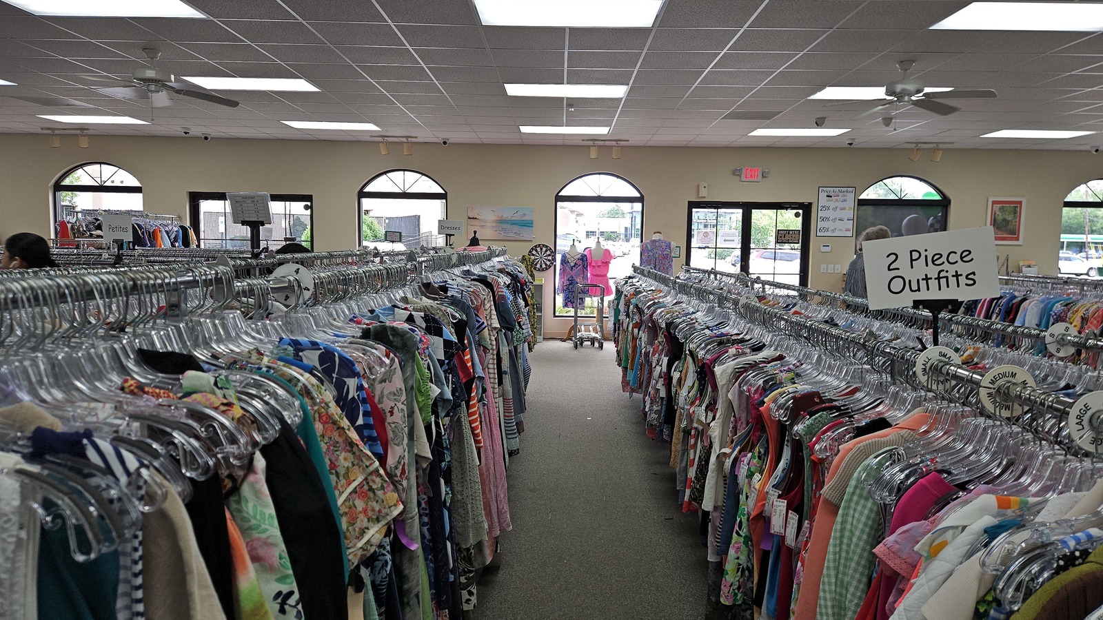 Rows of neatly organized clothing with shoes and accessories inside etc. Consignment Shoppe in Winston-Salem