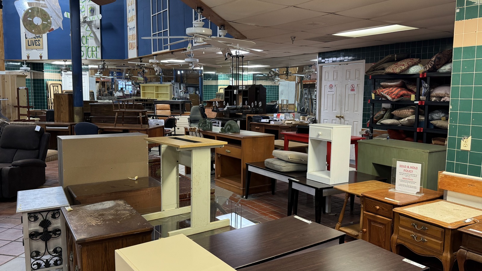 Tables, cabinets, and home furnishings across the Habitat ReStore showroom