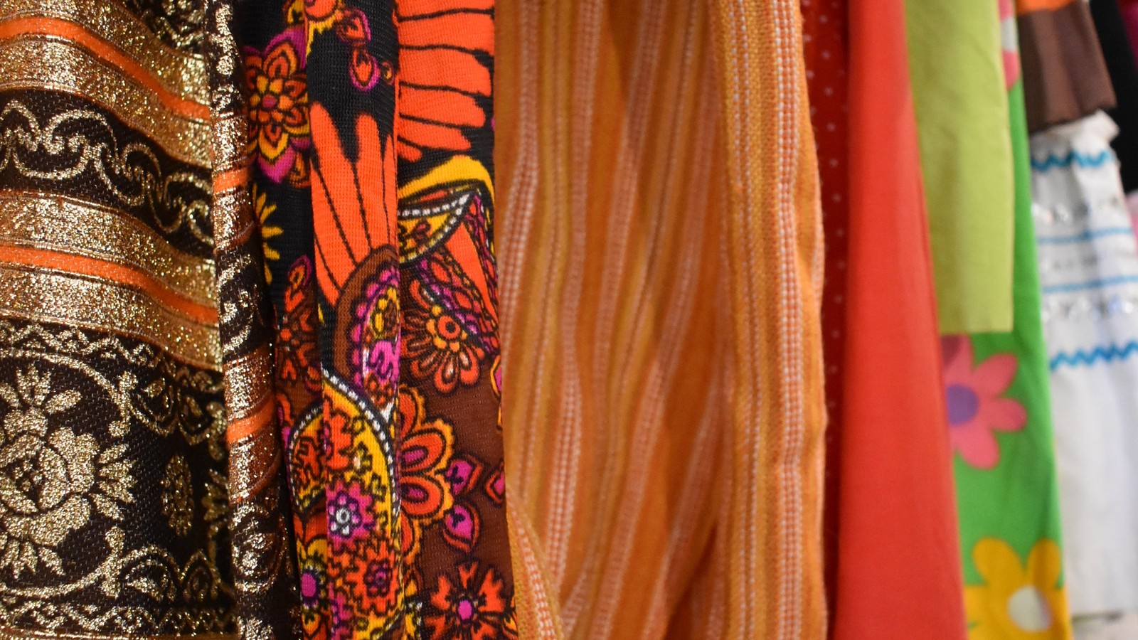 Colorful vintage textiles hanging inside Desert Moss Vintage in Santa Fe