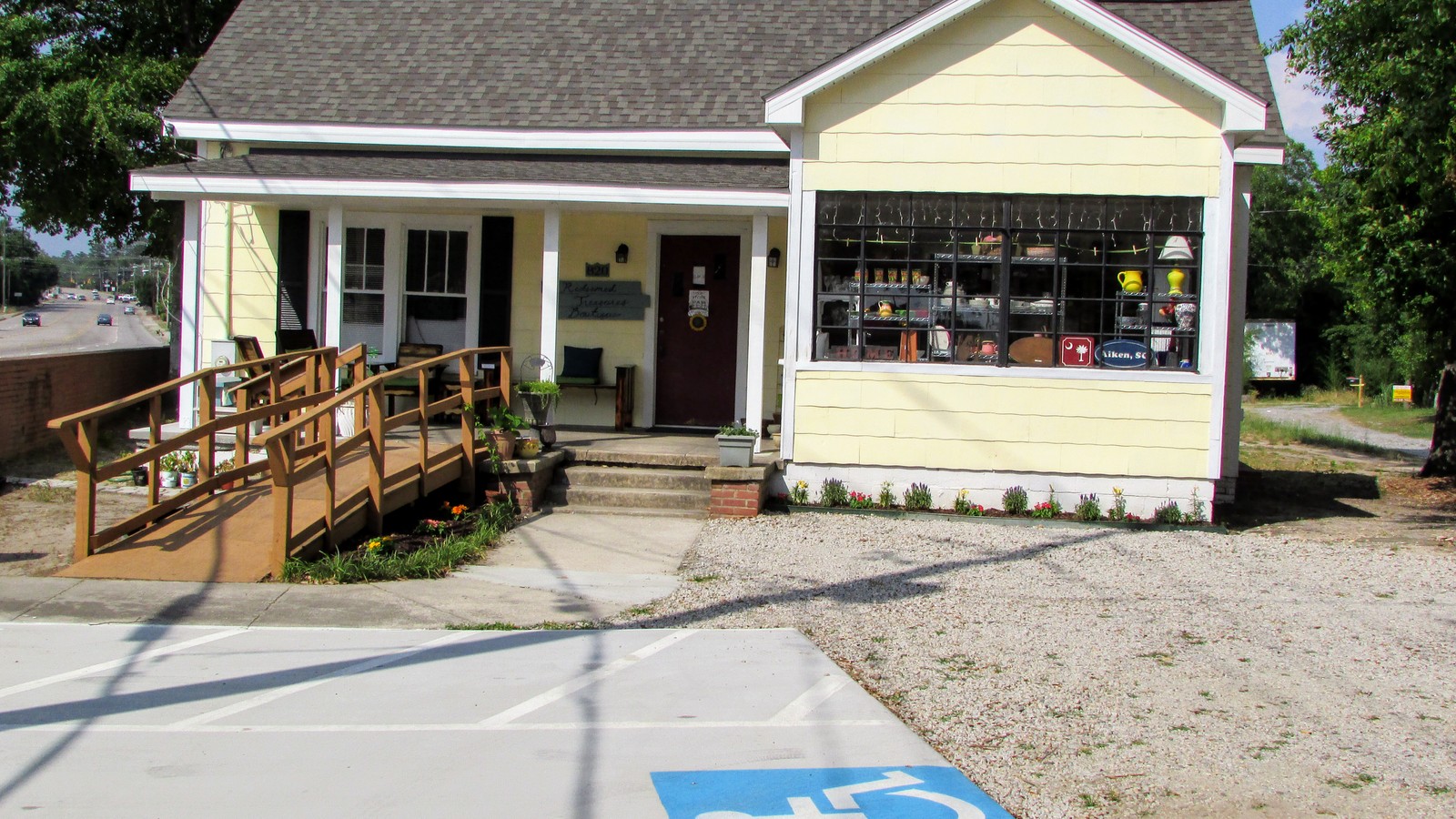 Yellow cottage storefront of Redeemed Treasures Boutique in Aiken
