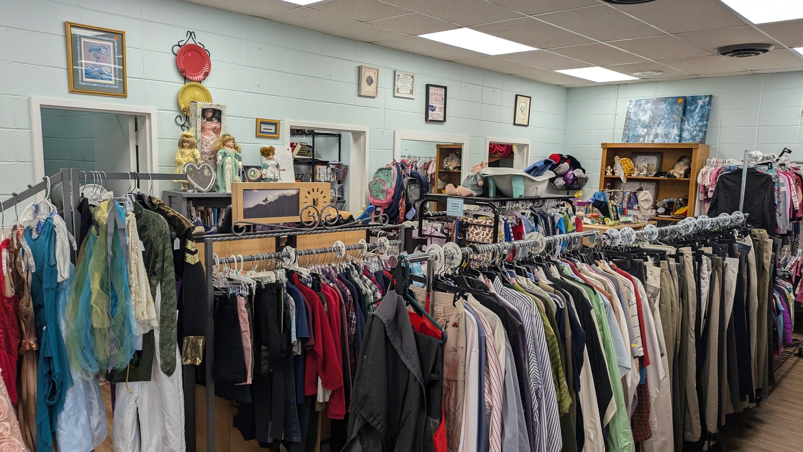 Colorful clothing racks inside Treasure House Thrift and More in Beaufort