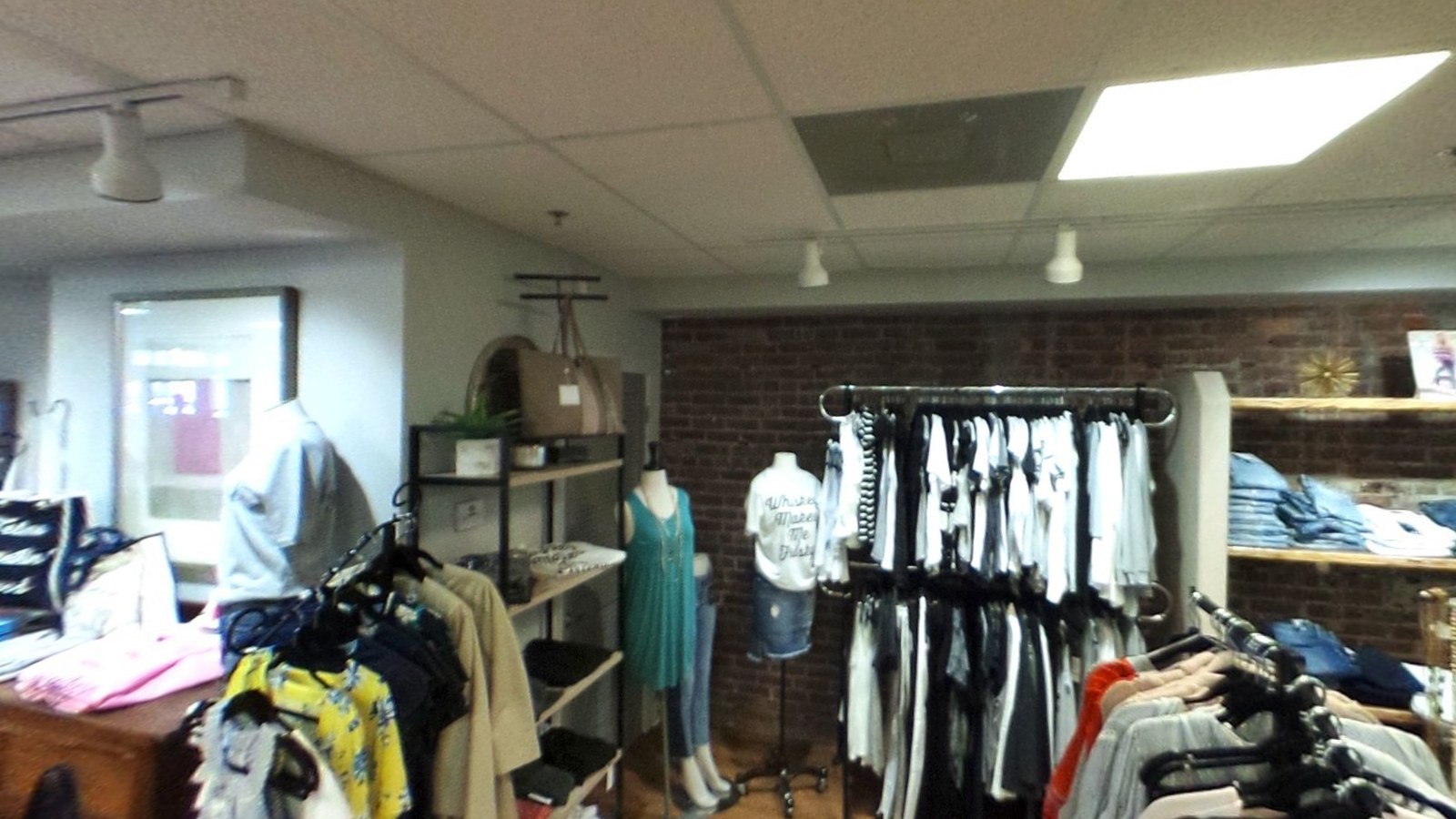 Clothing racks and folded denim at It's Retail Therapy in Beaufort