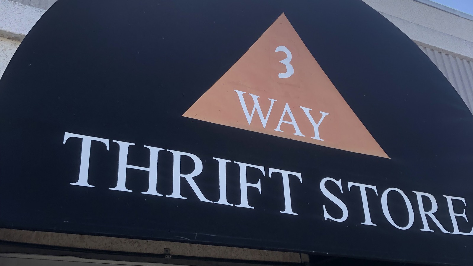 Black and copper 3 Way Thrift Store sign in Chino