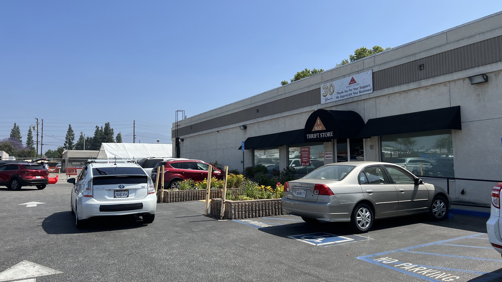 Central Avenue storefront and parking area at 3 Way Thrift Store