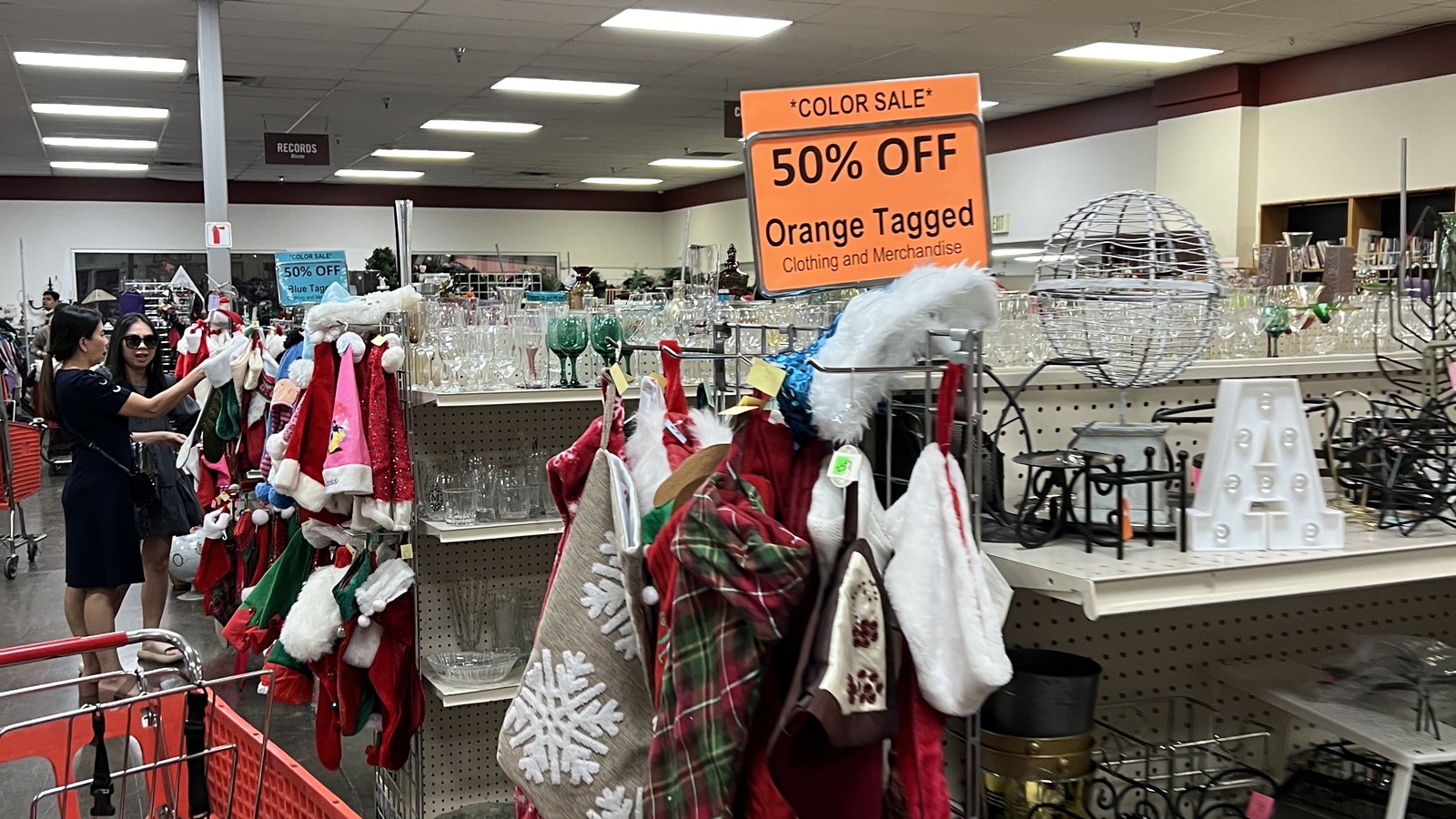 Orange color tag sale display inside the Chino thrift store