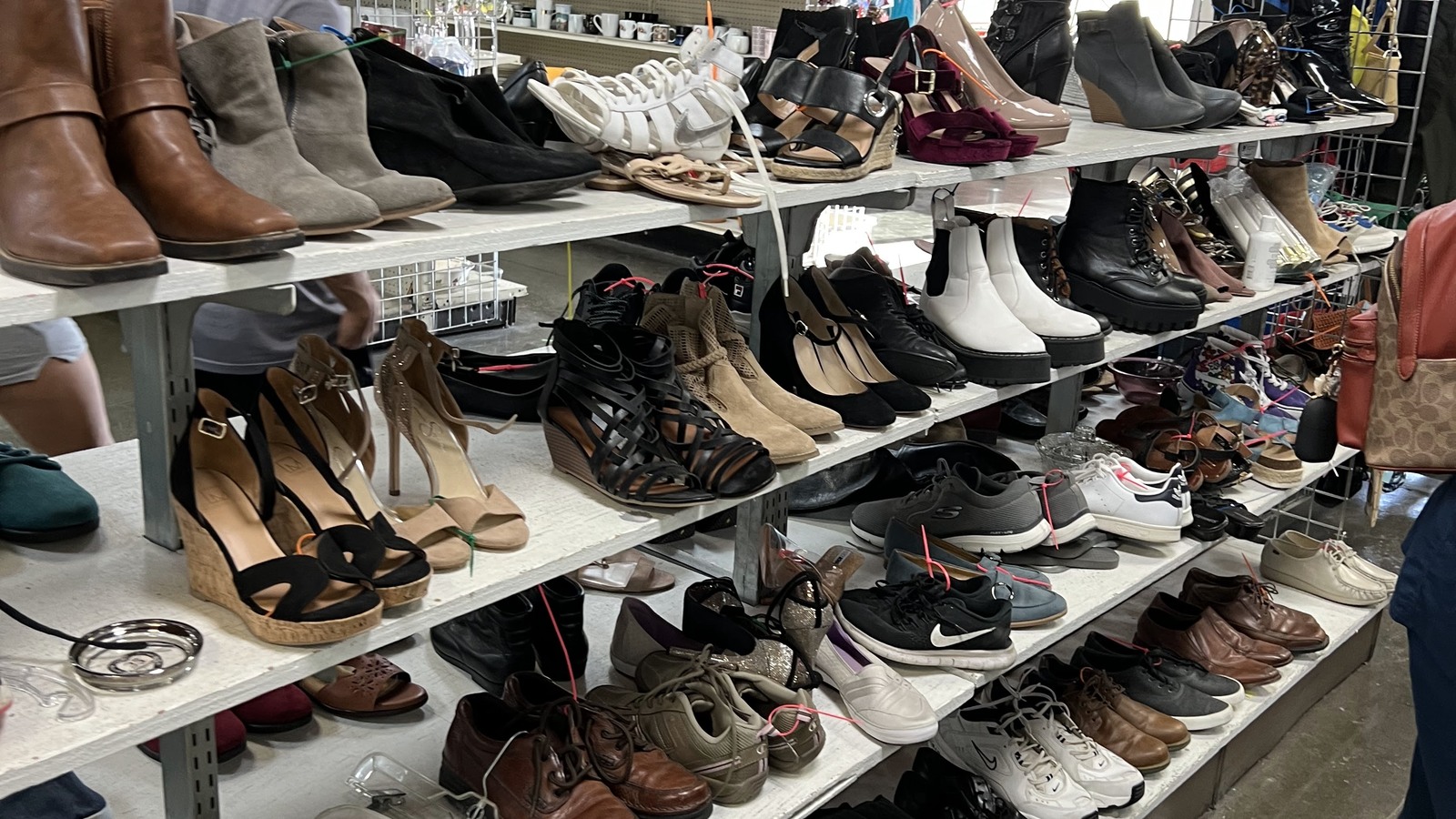 Shelves filled with boots, heels, sneakers, and sandals