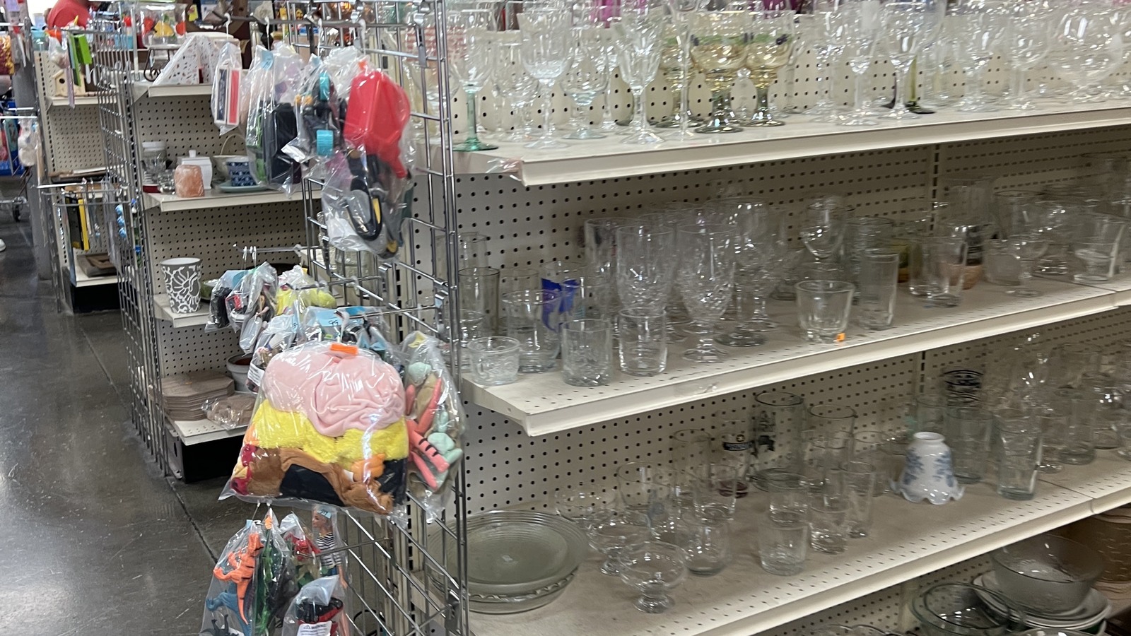 Clear glassware and serving pieces arranged along an aisle