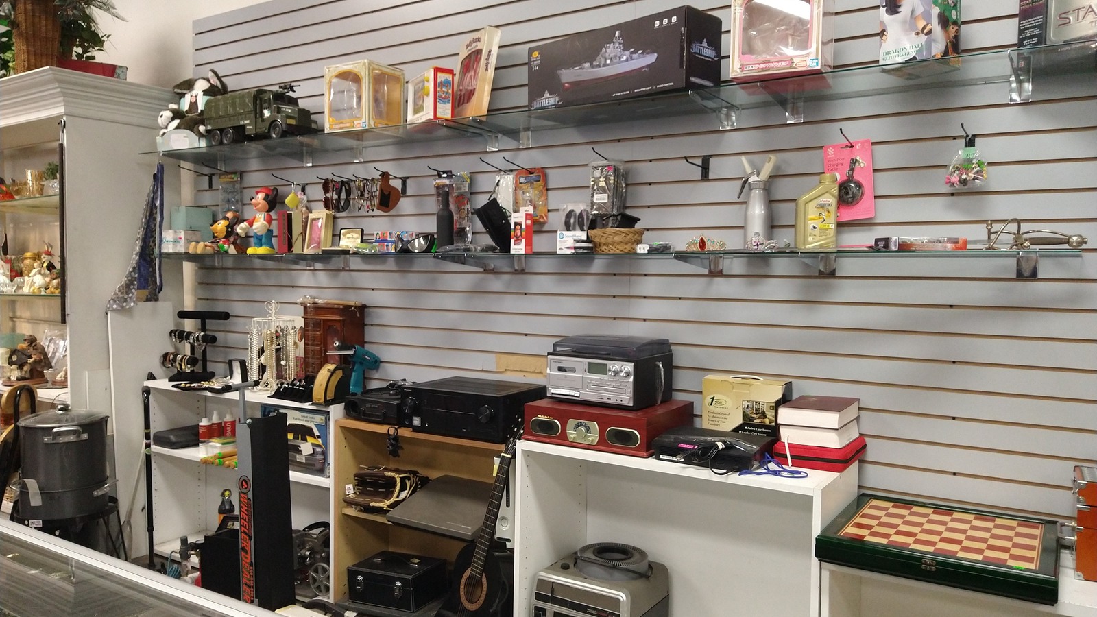 Radios, speakers, and small electronics on display shelves