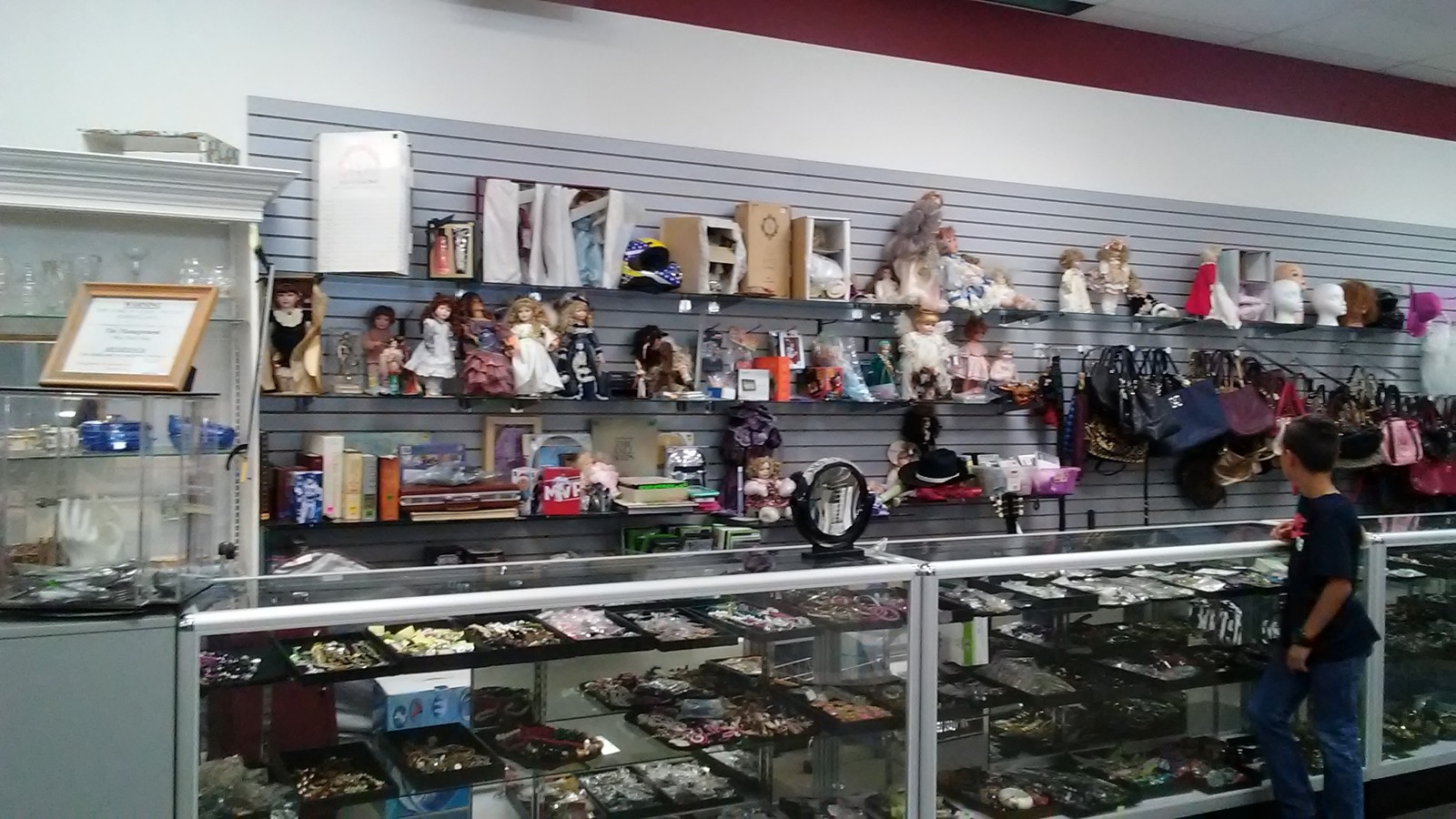 Glass display cases filled with jewelry and collectible pieces