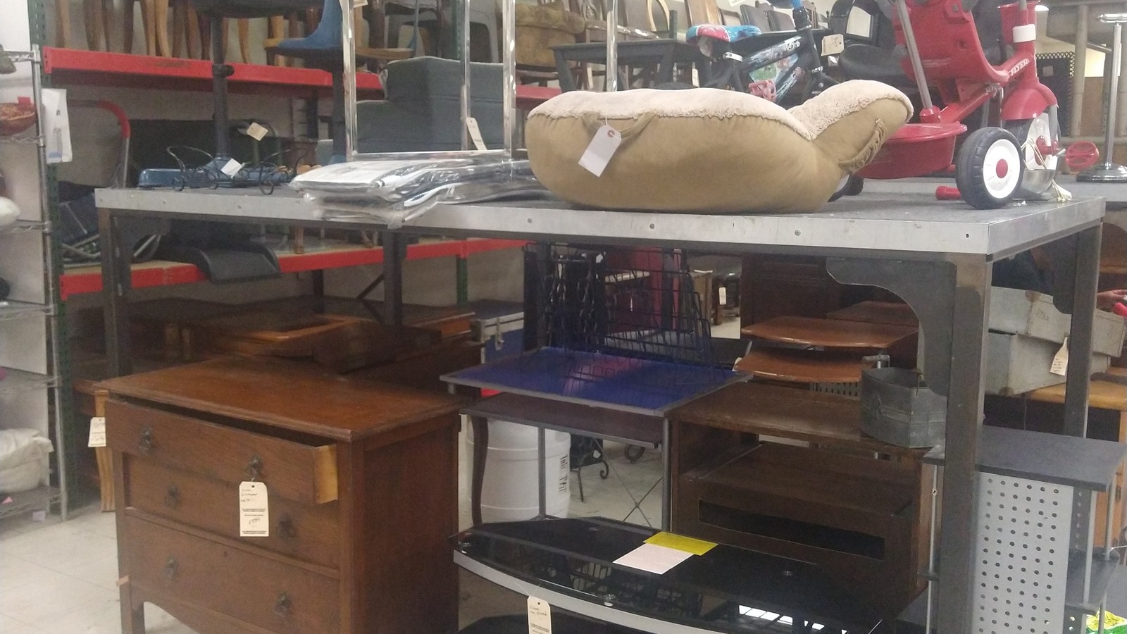 Tables, cabinets, chairs, and household furniture at Quality Thrift Store