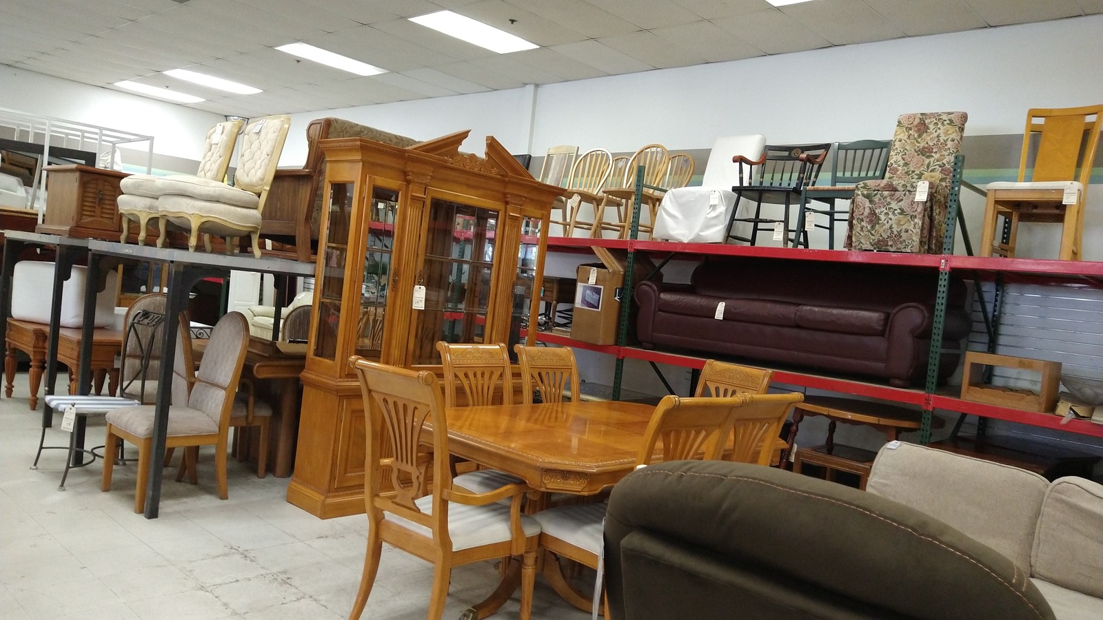 Wood dining tables, chairs, cabinets, and upholstered seating