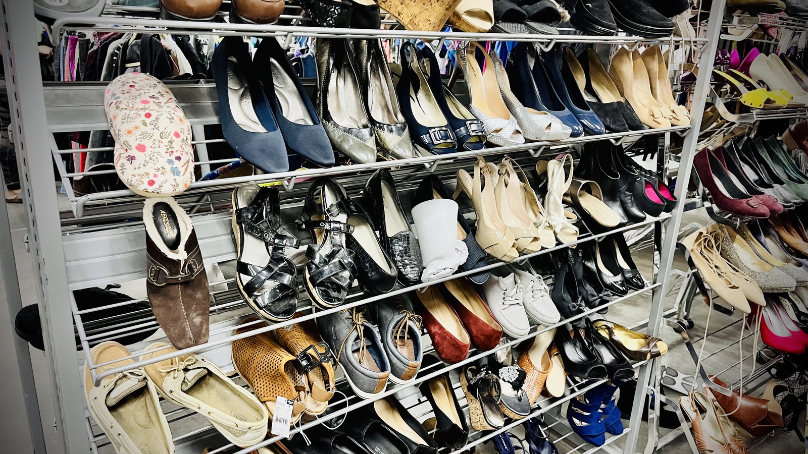 Racks packed with flats, heels, sandals, and casual shoes